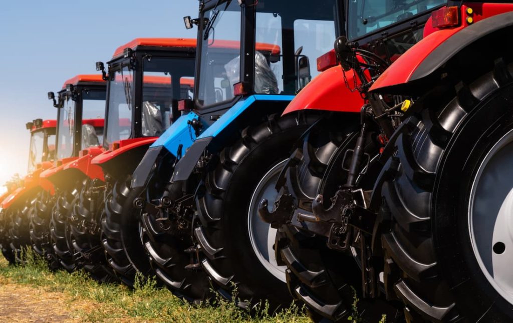 Row of red and blue tractors